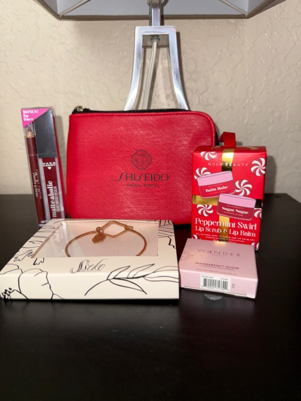 Shiseido Red Cosmetic Pouch.NCLA Beauty. Hard Candy. Wander & bracelet